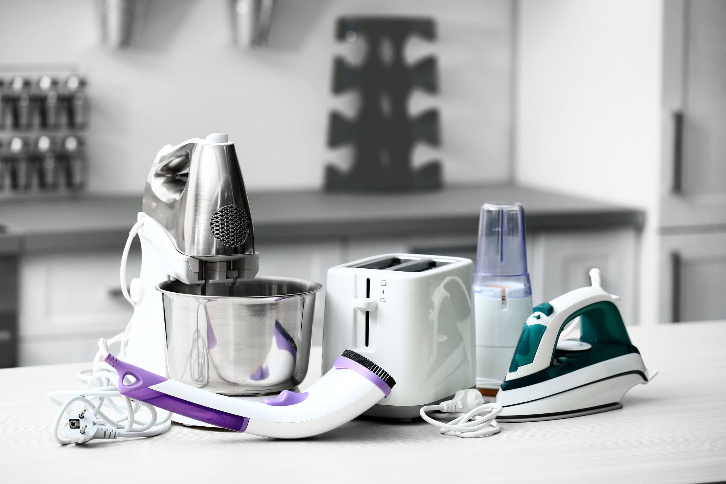 Household and kitchen appliances on the table in kitchen